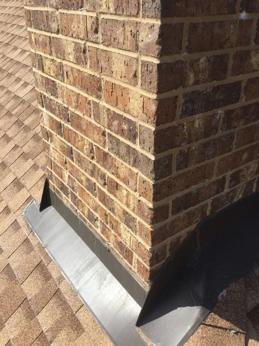 Damaged chimney flashing requiring repair